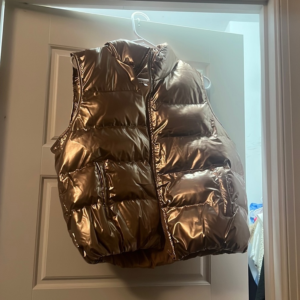 women’s gold puffer vest worn once in great condition size large